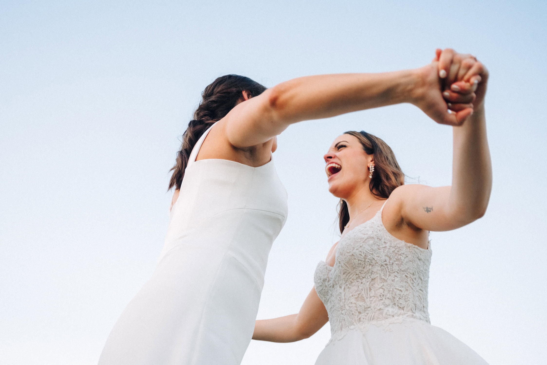 Brides being themselves as Queer wedding photographer captures their personalities for their LGBTQ Wedding in Denver